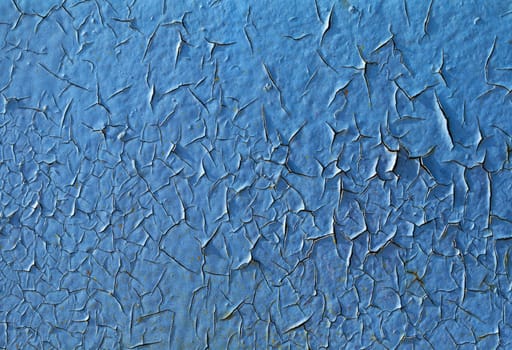 Close-up of peeling paint and rust on a wall