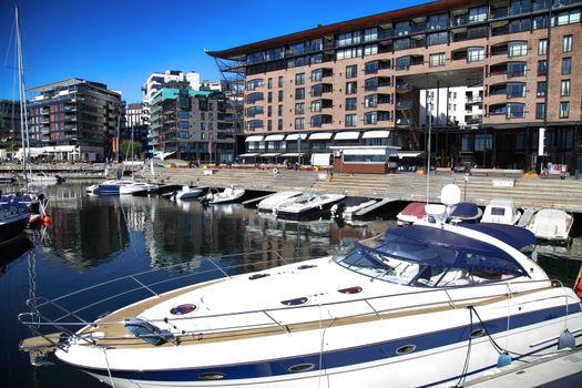 Yacht and modern district on street Stranden, Aker Brygge in Oslo, Norway