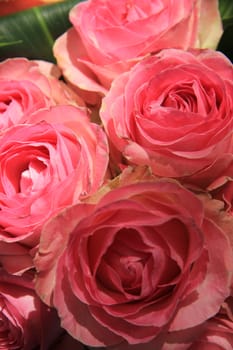 Pink roses in a bridal flower arrangement, centerpiece decorations