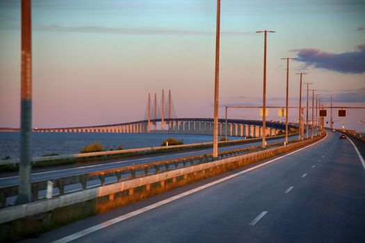 View on Oresund bridge between Sweden and Denmark at sunset