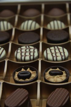 Chocolate candies in a golden gift box