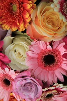 Gerberas and roses in bright colors in a bridal bouquet