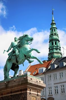 Hojbro Plads Square with the equestrian statue of Bishop Absalon and St Kunsthallen Nikolaj church in Copenhagen, Denmark