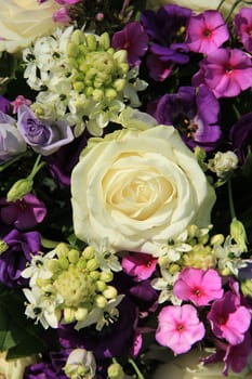 Purple and white wedding flower arrangement