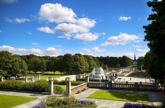 EDITORIAL OSLO, NORWAY - AUGUST 18, 2016: Many tourist walk Vigeland Sculptures Park in the popular Vigeland park ( Frogner Park ), designed by Gustav Vigeland in Oslo, Norway on August 18, 2016. 