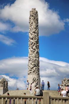 EDITORIAL OSLO, NORWAY - AUGUST 18, 2016: Many tourist walk Vigeland Sculptures Park in the popular Vigeland park ( Frogner Park ), designed by Gustav Vigeland in Oslo, Norway on August 18, 2016. 