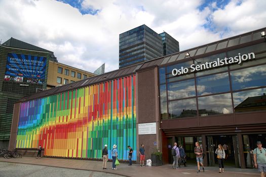 OSLO, NORWAY – AUGUST 18, 2016: People visit Oslo Central Station (Norwegian: Oslo sentralstasjon) is the main railway station in Oslo, Norway on August 18,2016.