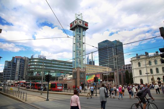 OSLO, NORWAY – AUGUST 18, 2016: People walking on wonderful Plaza in front of Oslo Central station on nice sunny day in Oslo, Norway on August 18,2016.