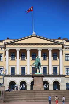 OSLO, NORWAY – AUGUST 17, 2016: Tourist visit The Royal Palace and statue of King Karl Johan XIV, Oslo is the capital city of Norway in Oslo, Norway on August 17,2016.