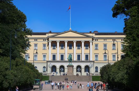 OSLO, NORWAY – AUGUST 17, 2016: Tourist visit The Royal Palace and statue of King Karl Johan XIV, Oslo is the capital city of Norway in Oslo, Norway on August 17,2016.