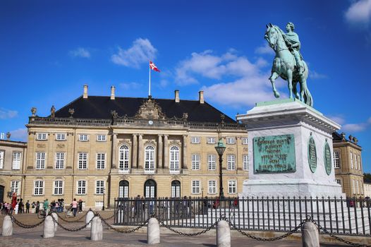 Copenhagen, Denmark – August  15, 2016: Sculpture of Frederik V on Horseback in Amalienborg Square, it's home of the Danish Royal family in Copenhagen, Denmark on August 15, 2016.