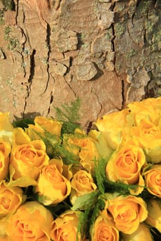 Yellow roses in a floral wedding arrangement