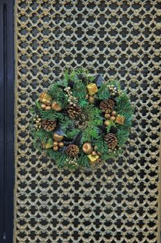 Classic christmas wreath with decorations on a door