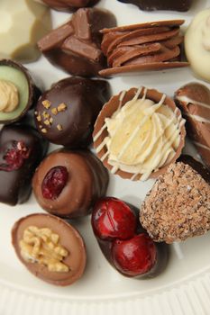 Belgium chocolates, decorated with nuts and fruits