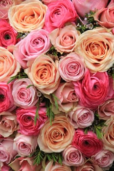 Pink roses and peonies in a mixed bridal bouquet