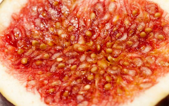 photographed close-up of red ripe fresh figs, cut into two halves
