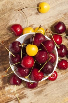 photographed close-up of ripe red cherries covered with water drops, shallow depth of field