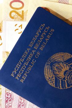 photographed closeup Belarusian passport and money lying in the document