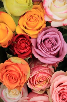 Multicolored roses in a colorful wedding arrangement