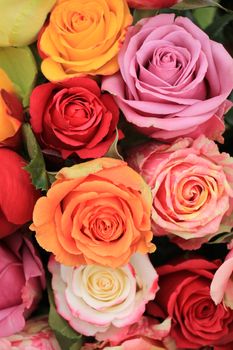 Multicolored roses in a colorful wedding arrangement
