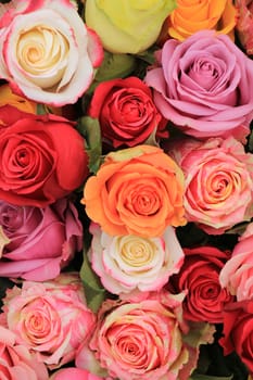 Multicolored roses in a colorful wedding arrangement