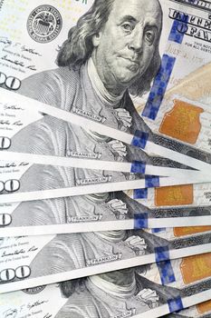 put together the American dollars. Photo close-up of banknotes on 100