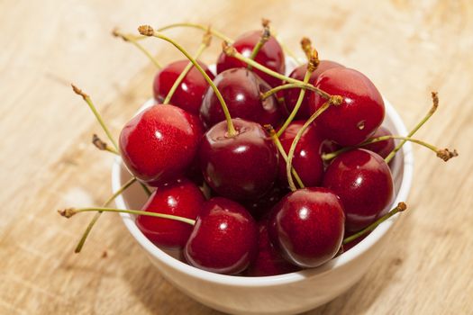 ripe cherry maroon. Berries are together after the harvest. Small depth of field. Photo taken closeup.