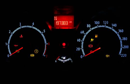 odometer inside car in night time dark background