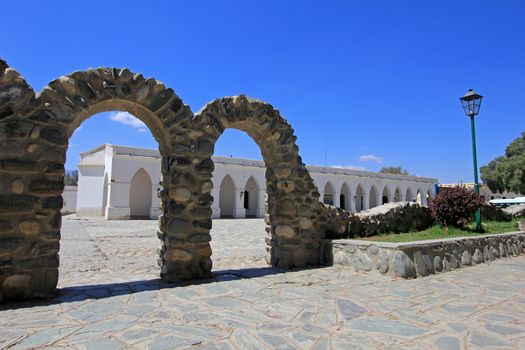 Arches behind main square, mountain village Cachi, , Calchaques, Salta Northern Argentina