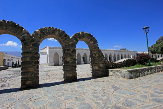 Arches behind main square, mountain village Cachi, , Calchaques, Salta Northern Argentina