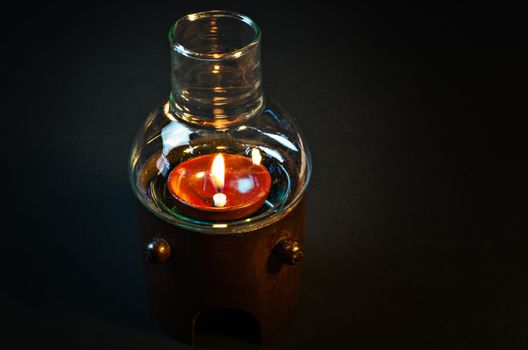 Glass lamps with bamboo on black background