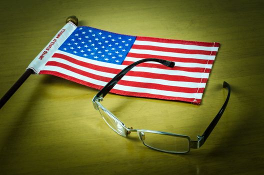 USA flag glasses on 
wooden table
White background