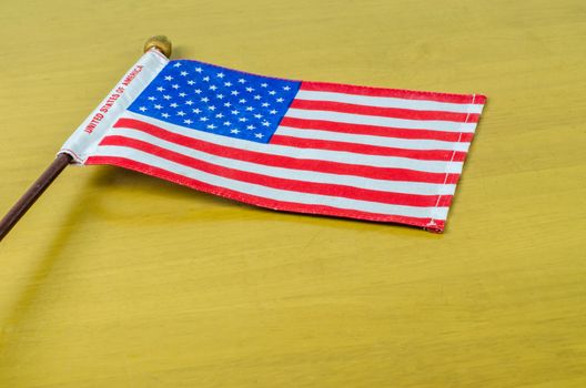 USA flag on 
wooden table
White background