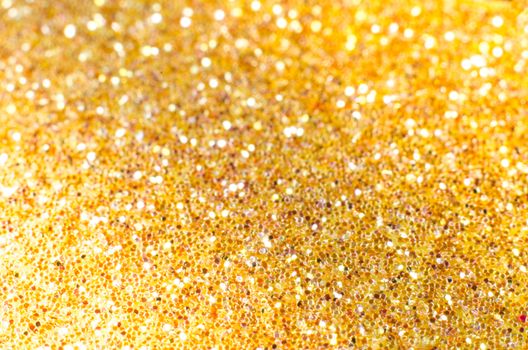 Gold defocused Christmas festival glitter background with copy space