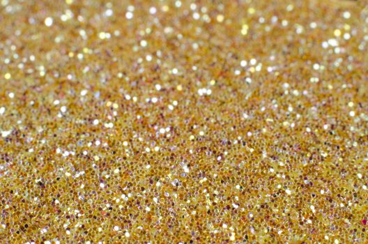 Gold defocused Christmas festival glitter background with copy space