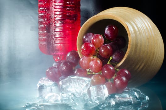 Grape glasses  red wine  closeup a black background.