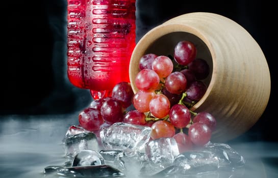 Grape glasses  red wine  closeup a black background.