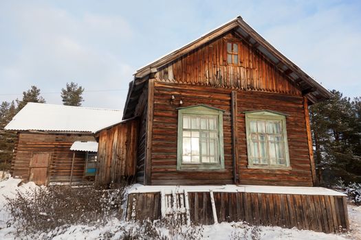 Old wooden house in the Russian village in the north