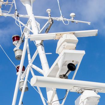 Mast of a modern ship with a horn, lamps and other equipment - Selective focus