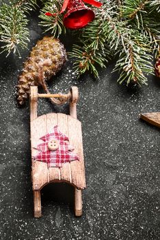 Spruce branches with pinecones and Christmas ornaments