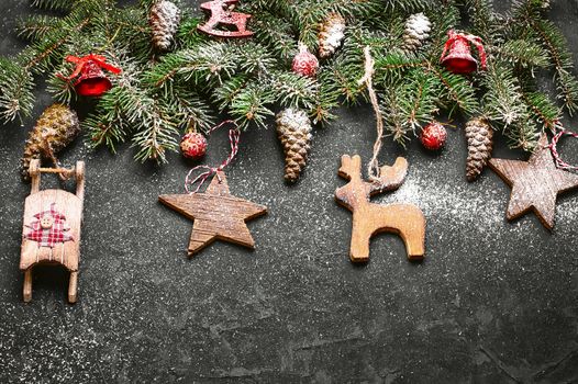 Spruce branches with pinecones and Christmas ornaments