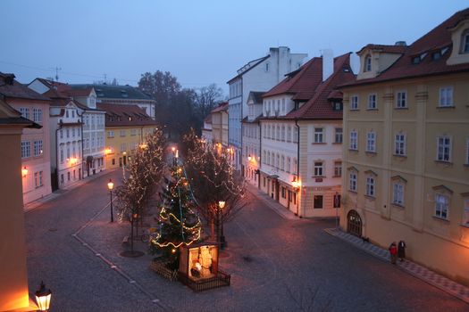 The area near Karlovy Bridge in Prague with a fir-tree and New Year's furniture