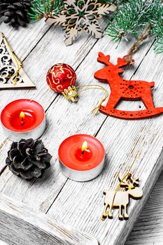 Wooden box with Christmas toys and Christmas tree branch