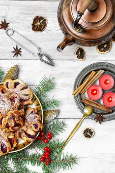 Homemade cookies on plate decorated with fir branches