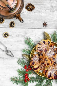 Homemade cookies on plate decorated with fir branches