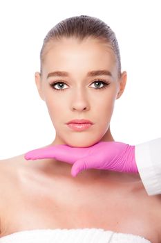 Beautiful face ready for Cosmetic skincare spa beauty treatment with pink glove, on white.