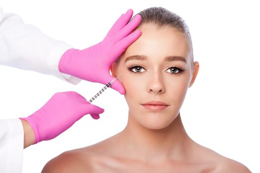 Beautiful face crows feet injection Cosmetic skincare spa beauty treatment with pink gloves by eye, on white.
