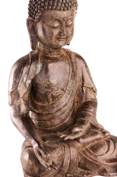 Buddha Shakyamuni's figure in a blessing pose - varada mudra. The old statue made of metal isolated on a white background.