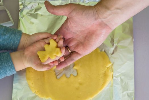 shortcrust dough for children's hands with dad hands