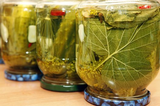 Glass jar with pickled cucumbers